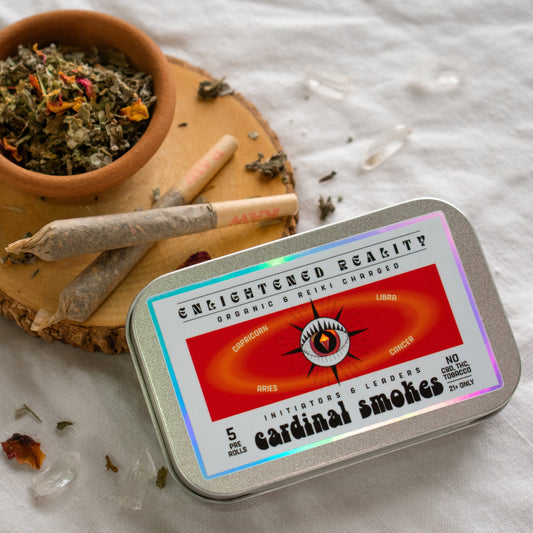 Organic Herbal Smoking Blend in metal tin on display surrounded by crystals for energetic balance and mindfulness