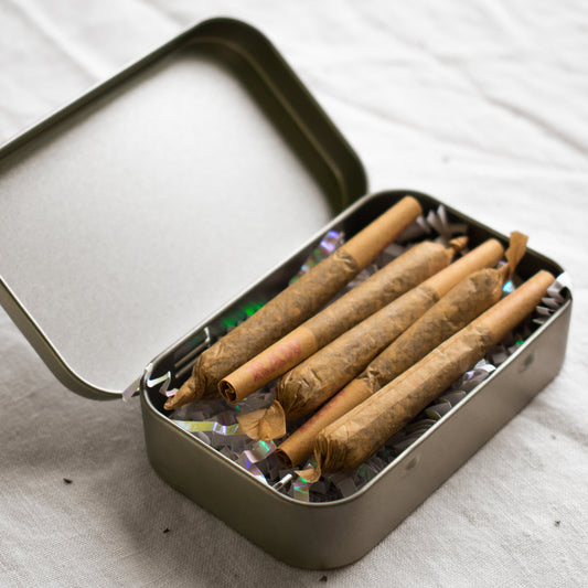 Organic Herbal Smoking Blend pre-roll 5 pack in metal tin for energetic balance and mindfulness
