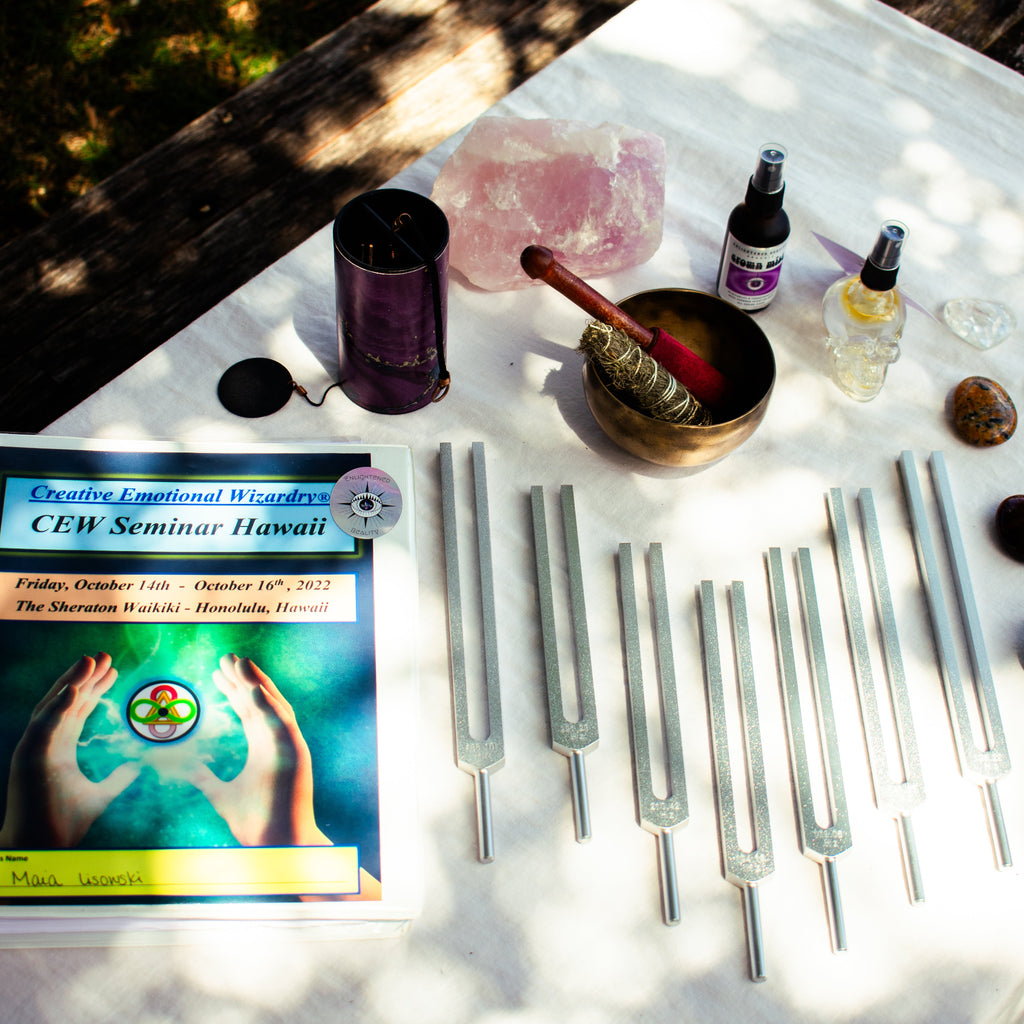 Table with books, bottles, and crystal instruments outdoors