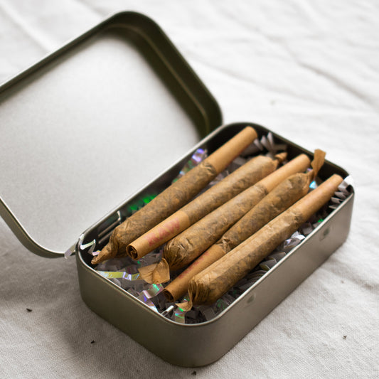 Organic Herbal Smoking Blend pre-roll 5 pack in metal tin for energetic balance and mindfulness