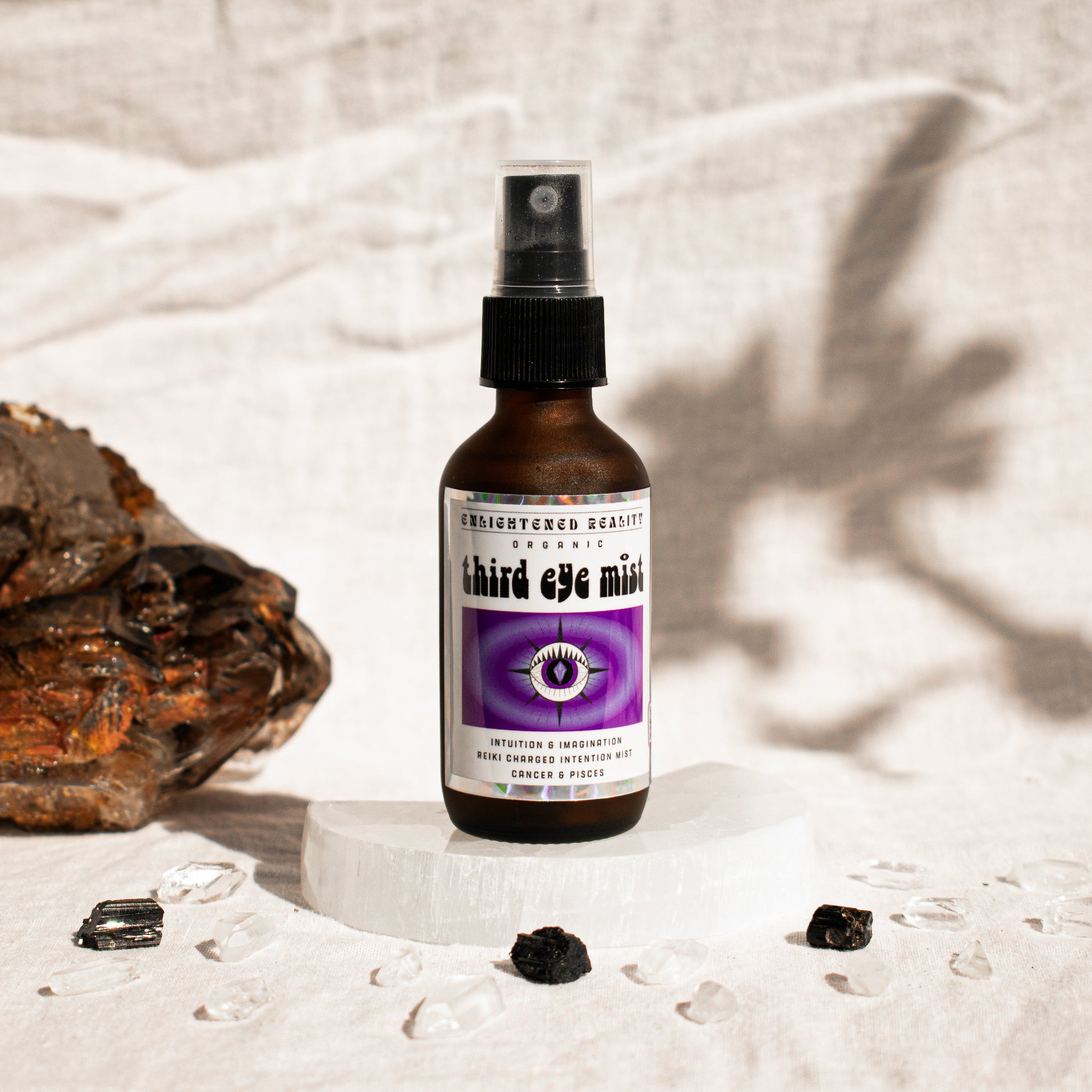 Close-up of organic chakra mist bottle label with Reiki-charged ingredients for energy healing