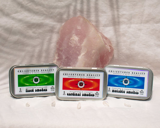 Trio of Organic 5 Pack Pre Rolls Herbal Smoking Blends displayed with rose quartz for astrological and spiritual rituals