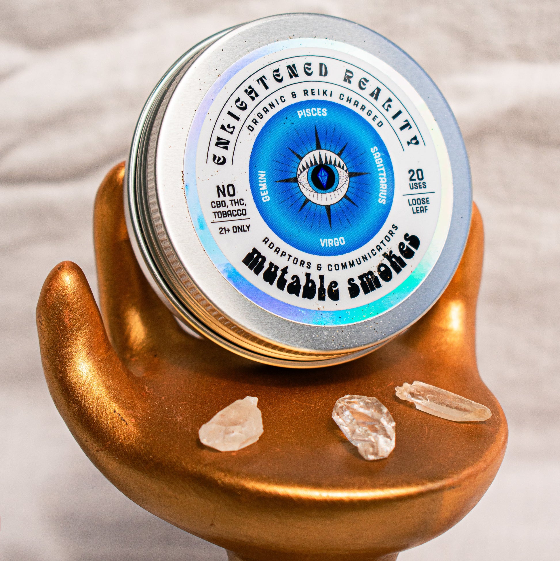 Close-up of Organic Herbal Smoking Blend in metal tin with crystal altar setup for ritual use