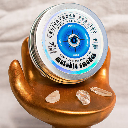 Close-up of Organic Herbal Smoking Blend in metal tin with crystal altar setup for ritual use