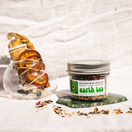Organic Elemental Herbal Tea in glass jar with crystals for grounding and energy healing