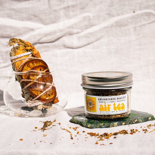 Organic Elemental Herbal Tea in glass jar with crystals for grounding and energy healing