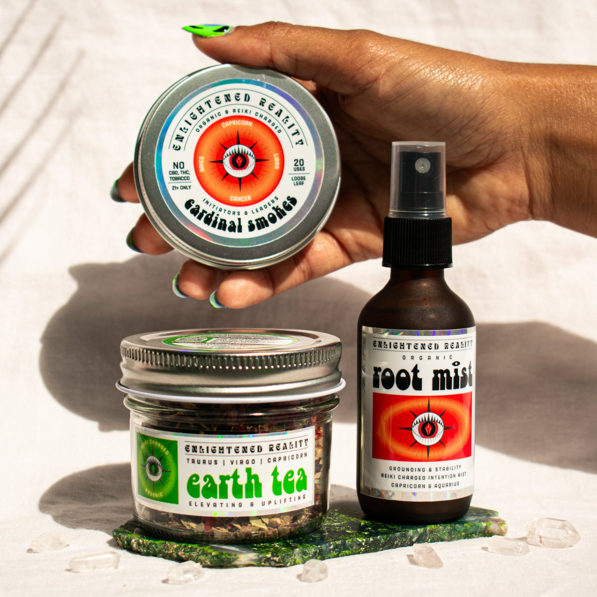 Organic Capricorn Zodiac Ritual Bundle featuring Root Chakra Mist, Earth Element Tea, and Cardinal Smoking Blend with crystal altar